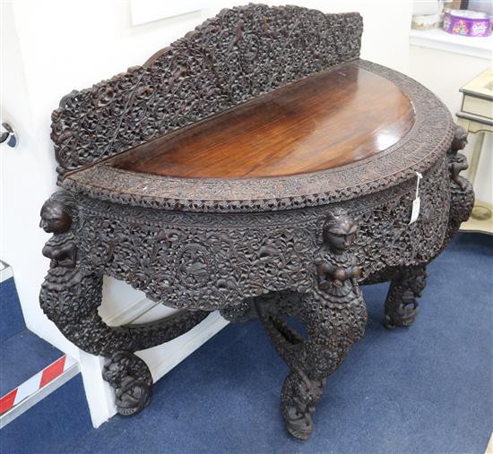 A 19th century Burmese carved hardwood console table, W.5ft 2in. D.2ft 2in. H.3ft 6in.